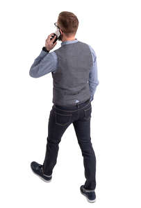 man walking and talking on a phone