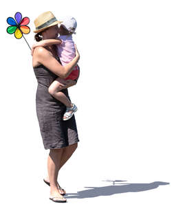 woman walking while carrying her daughter