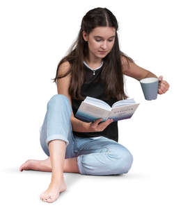 woman sitting on the floor and reading a book