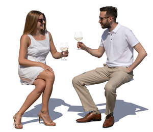 man and woman sitting in a cafe on a summer day