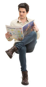 man sitting and reading a newspaper