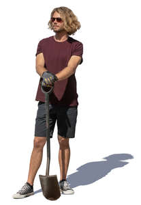 man with a spade standing