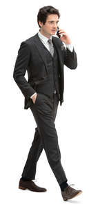 man in a formal black suit walking