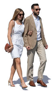 man and woman in fancy summer outfits walking