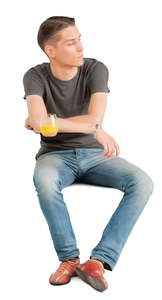 young man sitting at a cafe table