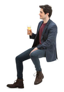 man sitting at a bar and drinking beer