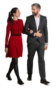 couple in formal clothes walking arm in arm