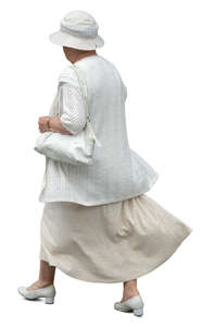 older woman in a white summer costume walking