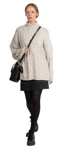 woman in a white sweater walking