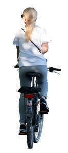 woman biking in tree shade