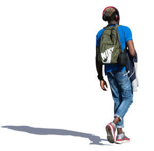 black man with headphones walking