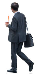 asian businessman with a coffee cup walking