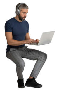 man sitting and working with a computer