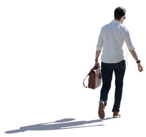 backlit man walking on a summer day