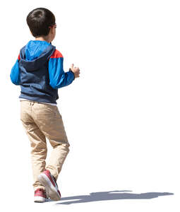 little boy with dark hair walking