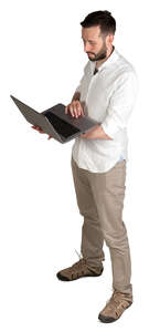 man with a laptop standing seen from above