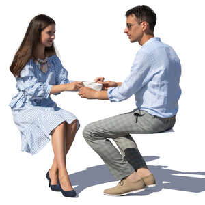 man and woman sitting in a restaurant