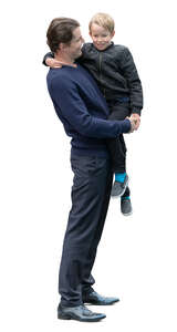 man standing and holding his son