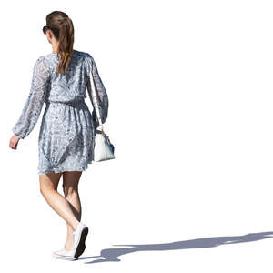 woman in a grey summer dress walking