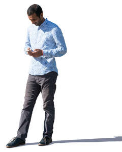 hindu man standing and texting