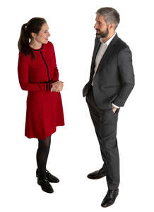 man and woman talking at a formal event