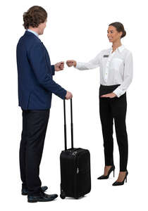 hotel receptionist talking to a businessman