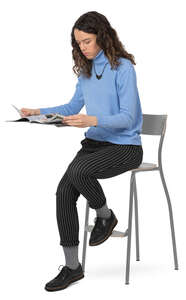 woman sitting at a counter and reading