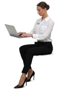 woman sitting and working with laptop