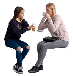 mother and daughter sitting in a cafe and talking