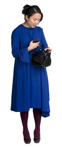 asian woman in a blue dress standing
