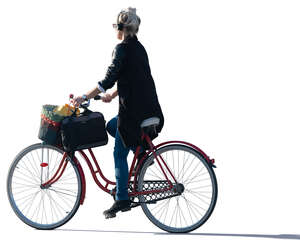 sidelit woman riding a bike