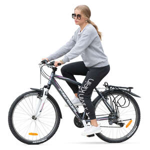 woman in sports outfit riding a bike