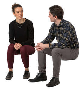 man and woman sitting and talking