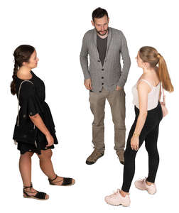 group of three people standing and talking