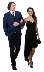 fancy man and woman walking arm in arm