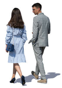 man and woman walking on a summer day