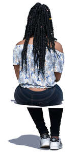 black woman sitting seen from behind