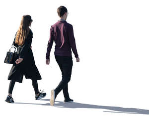 two young people walking with backlit light