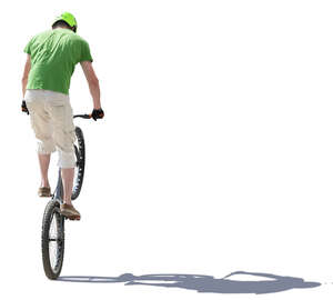 young man doing a stunt on a bike