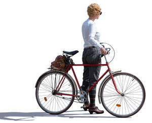 sidelit female cyclist in a vintage costume 