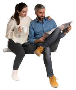 man and woman sitting ona sofa together