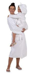 woman in a spa bathrobe standing and holding her daughter