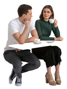 man and woman sitting in a cafe and talking