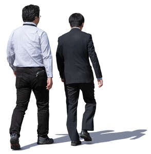 two asian businessmen walking