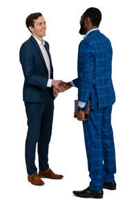 two young businessmen shaking hands