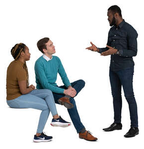 group of three adults sitting and talking