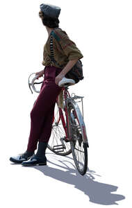 backlit woman leaning on a bike