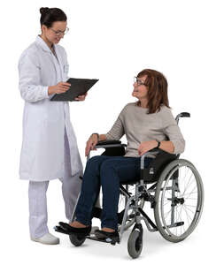 doctor talking to an older woman in a wheelchair