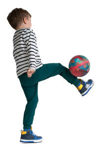 little boy playing football