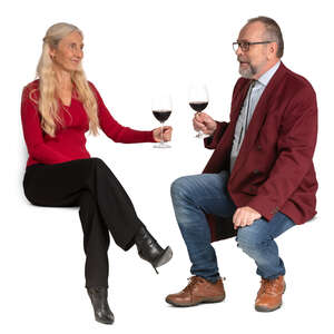 senior couple sitting in a cafe and drinking wine